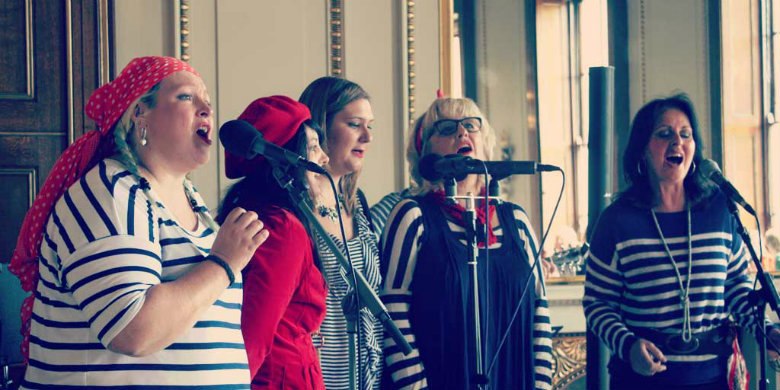 Jane Dolby (far left) singing with The Fishwives Choir at Fish Hall, 2014